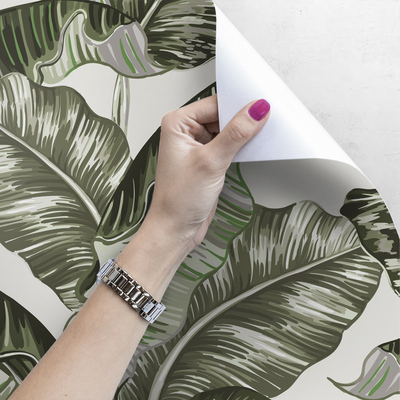 Fotobehang Rusten onder een bananenboom