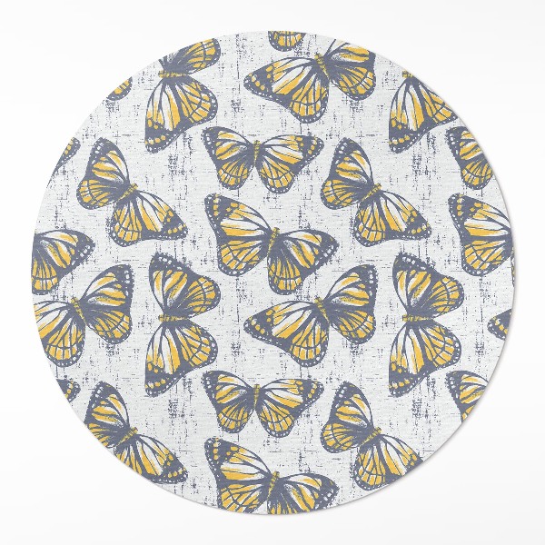 Rond pvc tapijt Gele vlinders op textuur