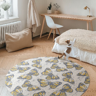 Rond pvc tapijt Gele vlinders op textuur