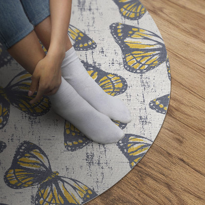 Rond pvc tapijt Gele vlinders op textuur