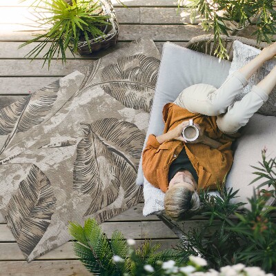 Buitenkleed Plantenbladeren en ruwe betontextuur