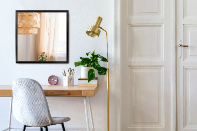 Decoratieve rechthoekige spiegel in een zwarte lijst