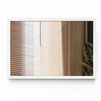 Decoratieve rechthoekige spiegel in een witte lijst