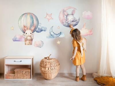 Muurstickers 130x173 Konijnen in een pastelkleurige lucht met een ballon 's nachts