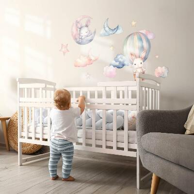 Muurstickers 60x80 Konijnen in een pastelkleurige lucht met een ballon 's nachts