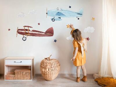 Muurstickers 60x74 Twee vliegtuigen in pastelkleurige aquarelwolken