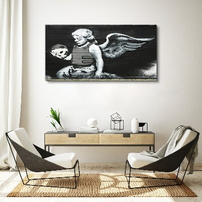 Canvas schilderij Een engel met een schedel tegen een graffiti-achtergrond