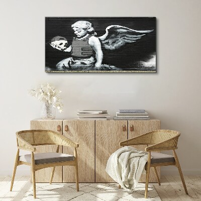 Canvas schilderij Een engel met een schedel tegen een graffiti-achtergrond