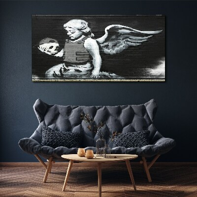 Canvas schilderij Een engel met een schedel tegen een graffiti-achtergrond