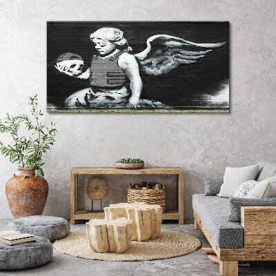 Canvas schilderij Een engel met een schedel tegen een graffiti-achtergrond