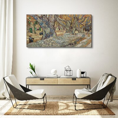 Canvas schilderij Een met bomen omzoomde straat in de lentezon