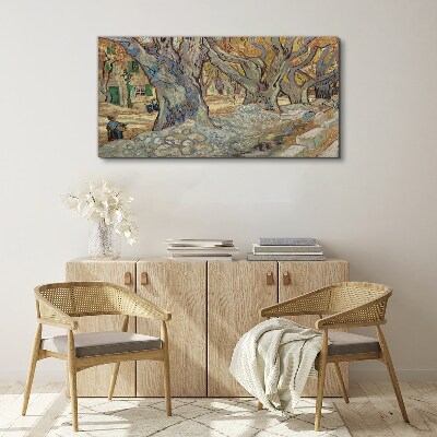 Canvas schilderij Een met bomen omzoomde straat in de lentezon