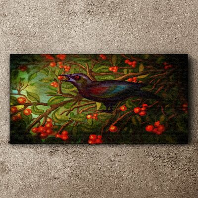 Foto op canvas Een vogel tegen de achtergrond van een fruittak