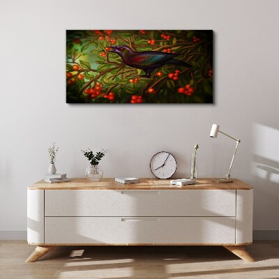 Foto op canvas Een vogel tegen de achtergrond van een fruittak