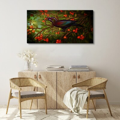 Foto op canvas Een vogel tegen de achtergrond van een fruittak