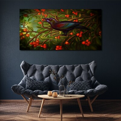 Foto op canvas Een vogel tegen de achtergrond van een fruittak