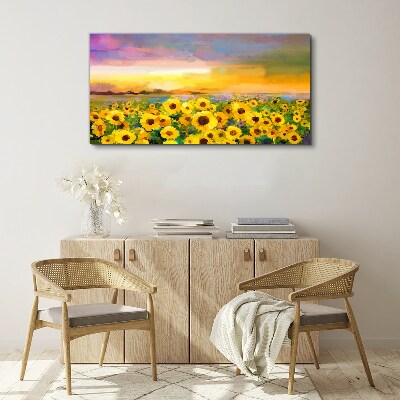 Schilderij op doek Zonnebloemen in de zonnestralen van de zonsondergang