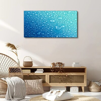Foto op canvas Waterdruppels op een blauwe achtergrond