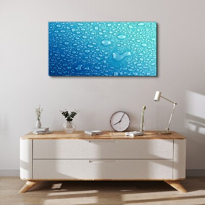 Foto op canvas Waterdruppels op een blauwe achtergrond