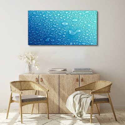 Foto op canvas Waterdruppels op een blauwe achtergrond