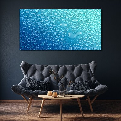 Foto op canvas Waterdruppels op een blauwe achtergrond