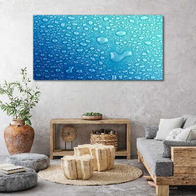 Foto op canvas Waterdruppels op een blauwe achtergrond