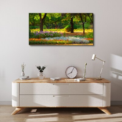 Schilderij op doek Een bloemenparadijs in een zonnige tuin