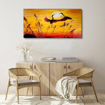 Foto op canvas Dansende kraanvogels bij zonsondergang