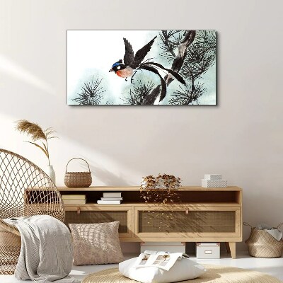 Foto op canvas Een vogel in vlucht over de dennen