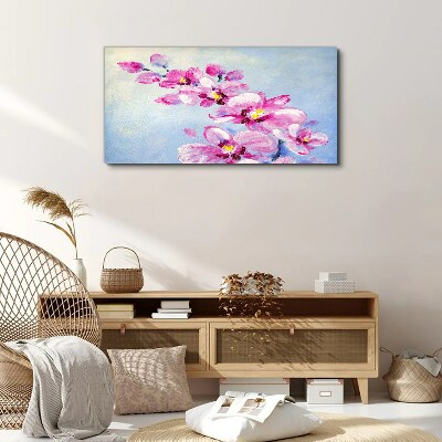 Foto op canvas Roze orchideeën op een blauwe achtergrond