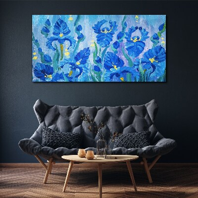 Schilderij op doek Blauwe irissen tegen een blauwe achtergrond
