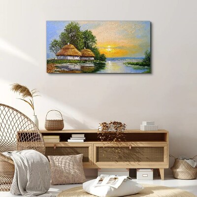 Canvas schilderij Een vredige zonsondergang boven het dorp