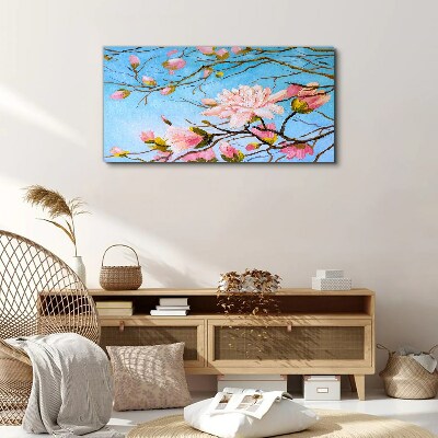 Canvas schilderij Magnoliabloemen op een blauwe achtergrond