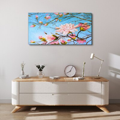 Canvas schilderij Magnoliabloemen op een blauwe achtergrond