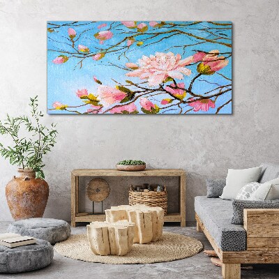 Canvas schilderij Magnoliabloemen op een blauwe achtergrond