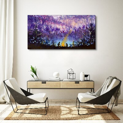 Foto op canvas De magie van een avondkampvuur in het bos