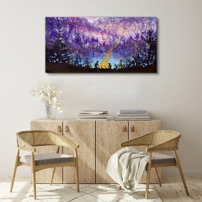 Foto op canvas De magie van een avondkampvuur in het bos