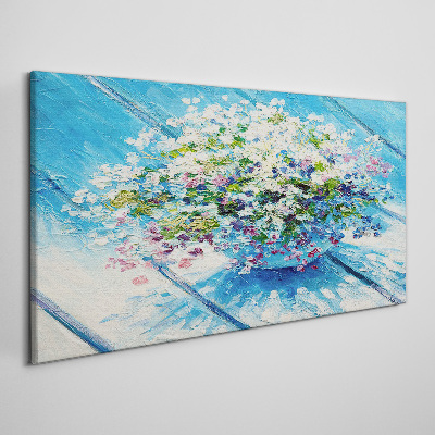Schilderij op doek Bloemencompositie op een blauwe achtergrond