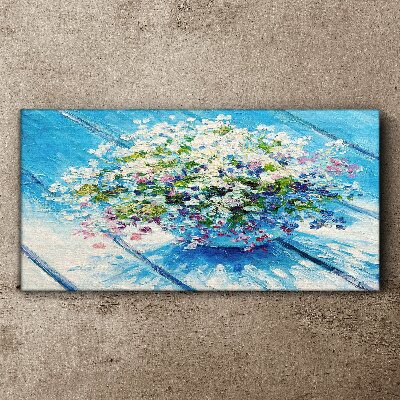 Schilderij op doek Bloemencompositie op een blauwe achtergrond