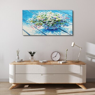 Schilderij op doek Bloemencompositie op een blauwe achtergrond