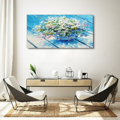 Schilderij op doek Bloemencompositie op een blauwe achtergrond