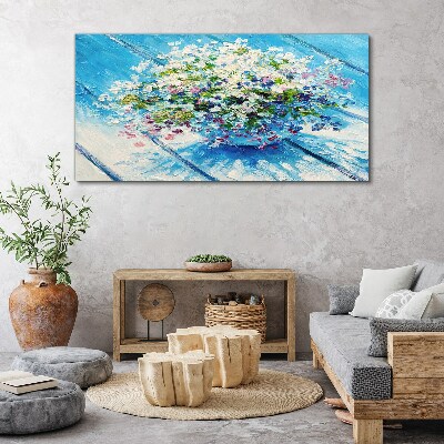 Schilderij op doek Bloemencompositie op een blauwe achtergrond