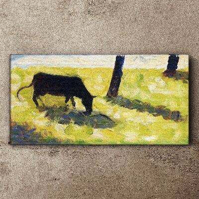 Canvas schilderij Een koe graast in een groen landschap