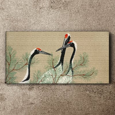 Schilderij op doek Drie kraanvogels tussen de dennentakken