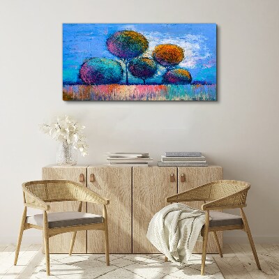 Schilderij op doek Kleurrijke bomen op een blauwe achtergrond