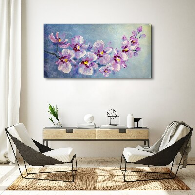 Canvas schilderij Bloemenorchideeën op een blauwe achtergrond