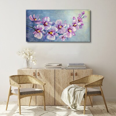 Canvas schilderij Bloemenorchideeën op een blauwe achtergrond