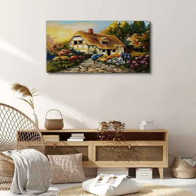 Canvas schilderij Een charmant landhuisje omgeven door bloemen