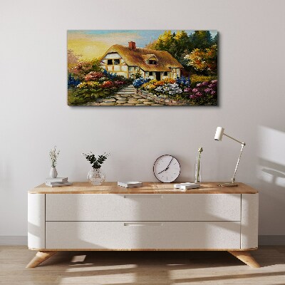 Canvas schilderij Een charmant landhuisje omgeven door bloemen