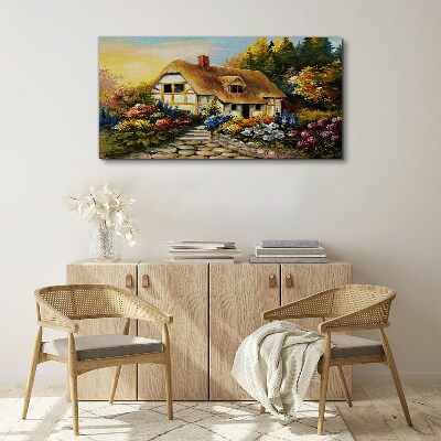 Canvas schilderij Een charmant landhuisje omgeven door bloemen